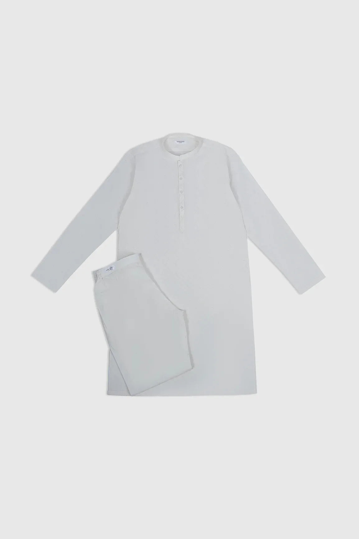 An off white cotton embroidered kurta trouser for kids, with button-down front and full sleeves.