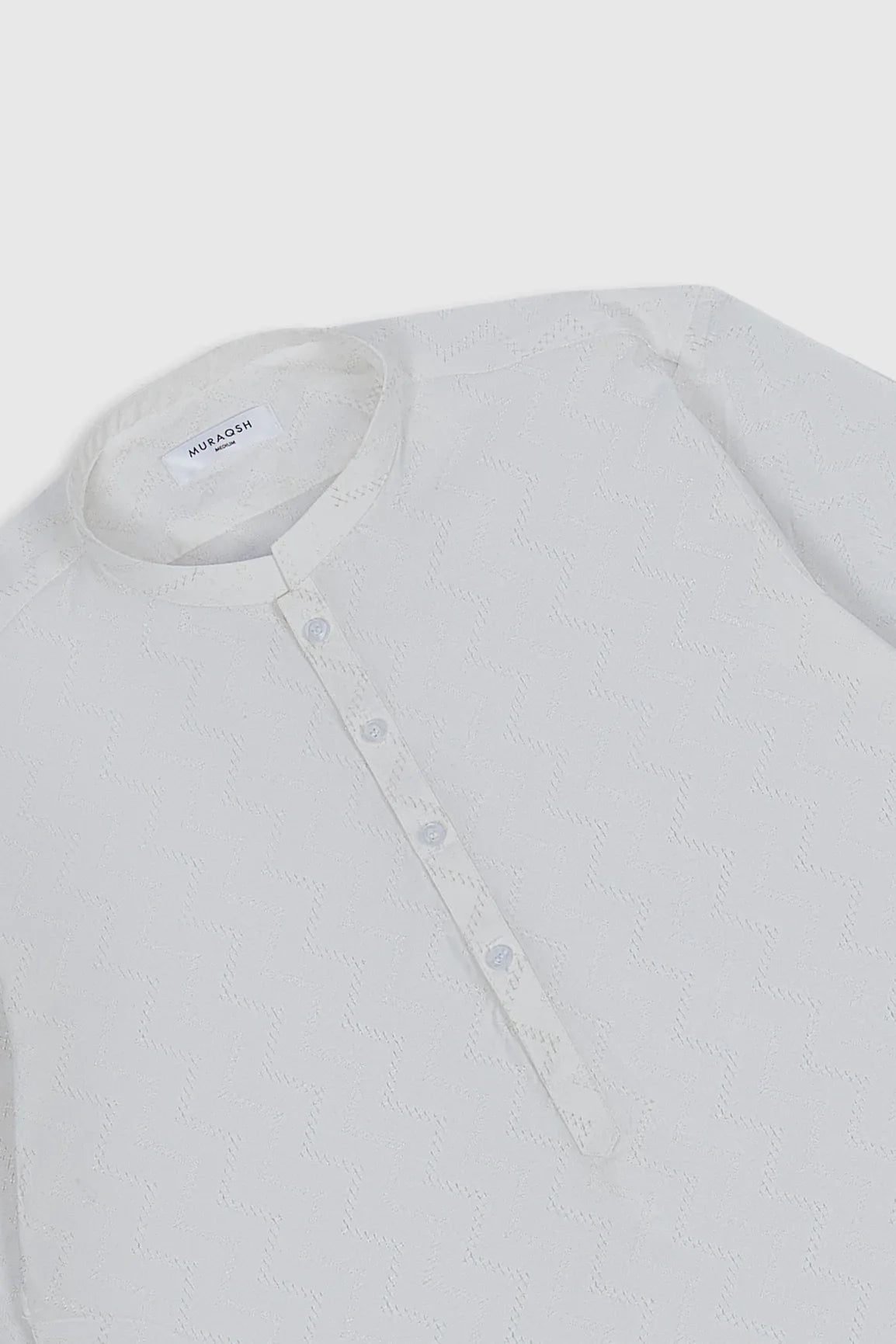 An off white cotton embroidered kurta trouser for kids, with button-down front and full sleeves.