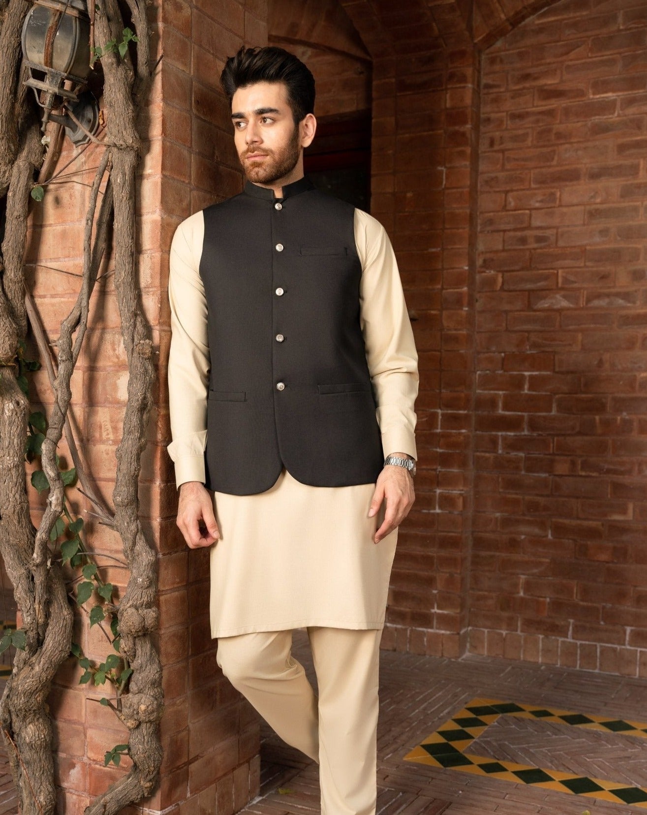 Black waistcoat on Ivory shalwar kameez for men